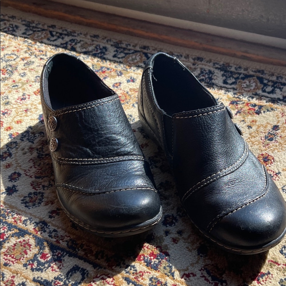 Clark’s women’s slip on black leather shoes.